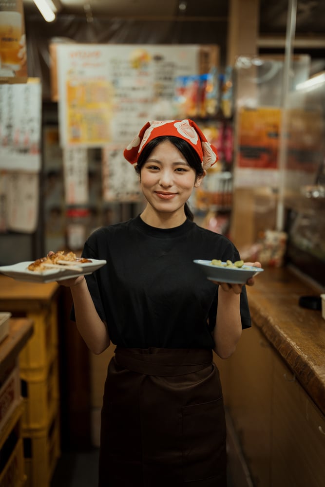 Izakaya Staff Serving Dishes