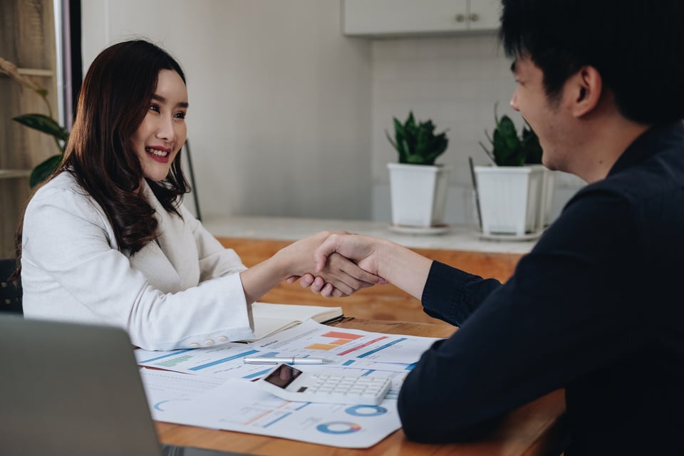 Negotiating business,Image of businesswomen Handshaking, Bus